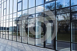 Modern glass windows office building architecture facade building outside urban view walking space in city