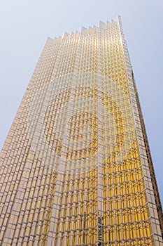 Modern glass yellow shiny skyscraper