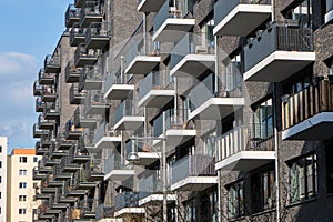 Modern gray apartment building made of bricks