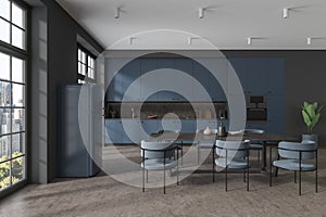 Modern gray and blue kitchen interior with table