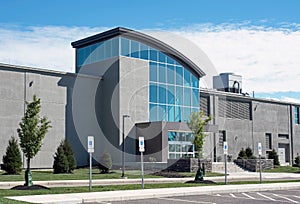 Modern Gray Building with Glass Concave Entrance photo