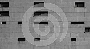 Modern Gray Concrete Wall with Windows and Rectangular Openings