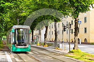 Modern green tram in Helsinki