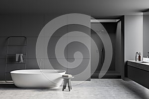 Modern grey bathroom with empty tiled wall
