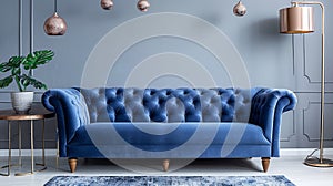 Modern grey interior with stylish blue sofa, lamps and elegant decor creates a cozy and inviting atmosphere for relaxation and