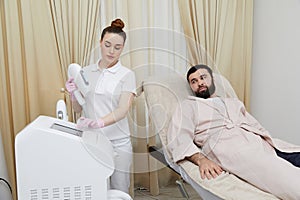 Modern grooming showcased: man undergoes facial laser hair removal in cosmetology clinic