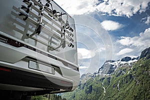 Modern Half Integral Camper Van on the Road Trip Bike Rack Close Up