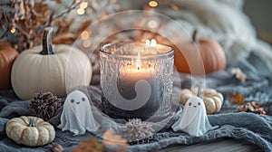 modern halloween decorations using eco-friendly materials glass candle holders, fabric ghost ornaments, and a photo