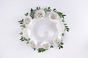 Modern hand painted easter egg on white background in the shape of a wreath. Happy easter poster and banner for greeting text.