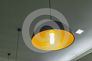 The modern hanging lamp on working room.