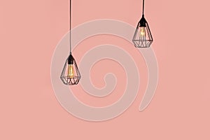 Modern hanging lamps on color background. Idea for interior design