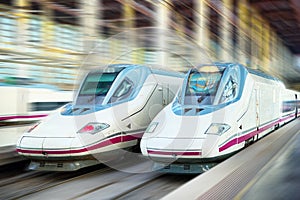 Modern hi-speed passenger train, in movement motion.