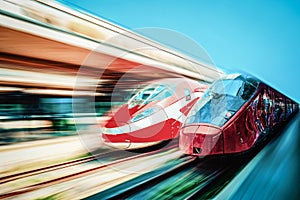 Modern hi-speed passenger train, in movement (motion) on railways station