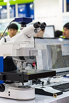 Modern & high accuracy microscope during sample or specimen inspection for quality control in industrial metallurgy electronic