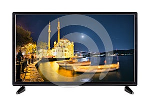 A modern high-definition television with picture of the night q