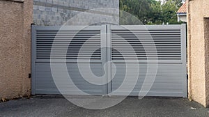 Modern high door gray gate high grey aluminum home portal with blades suburb house street