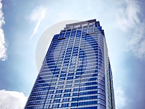 Modern High Rise Building Against Blue Sky