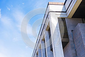Modern High-Rise Building with Gray Rectangular Tiles
