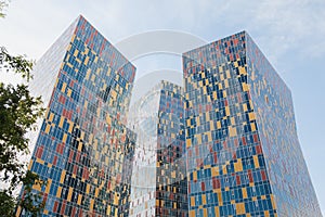 Modern high-rise buildings with multi-colored glass facade