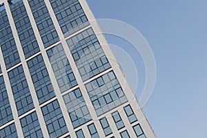 Modern High Rise Glass Building and Blue Sky