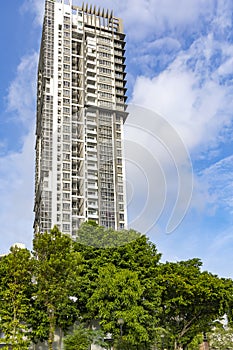 Modern high-rise residential buildings with a beautiful tropical garden