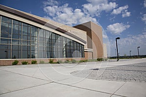 Modern high school with blue sky and clouds