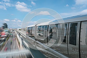 Modern high speed electric train departs from a station with motion blur effect