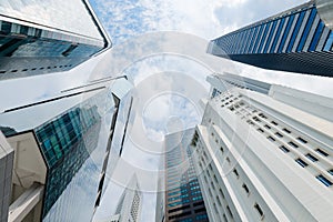 Modern Highrise Buildings Stretch Skyward on a Partly Cloudy Day photo