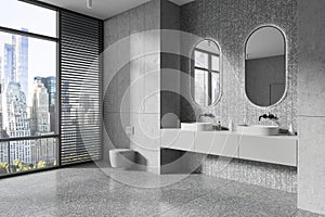 Modern home bathroom interior with toilet and double sink with panoramic window