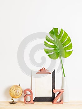 Modern home decor with blank sheet of paper on a clipboard