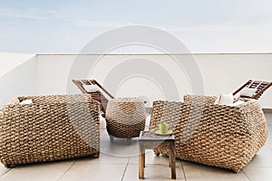 Modern home interior design with armchairs. Elegant rustic accessories with table and coffee cup. Stylish home or hotel decor