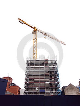 Modern home of office building construction with scaffolding. White background. New house development. Construction industry