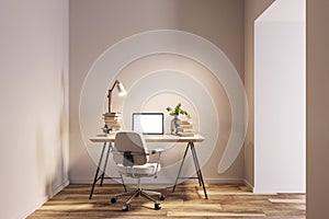 A modern home office interior with a desk, laptop, chair, lamp, and books on a beige and white background, concept of remote work