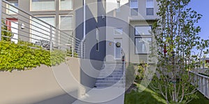 Modern home with stairs and porch in Daybreak Utah