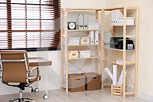 Modern home workplace with wooden storage