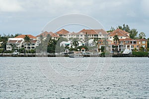 Modern homes for the wealthy people in traditional Caribbean style located in the harbour town of Nassau, Bahamas