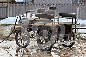 Modern horse-drawn carriage, waiting for horse and passengers