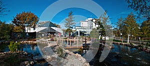 Modern hotel exterior with pond