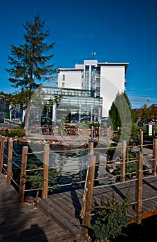 Modern hotel exterior with pond