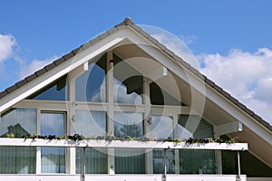 Modern house with balcony, blue sky