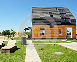 Modern House Construction. Solar water heating SWH systems use roof solar panels. Home Skylights, Dormer, Ventilation. photo