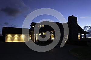 Modern house exterior with lighting at night