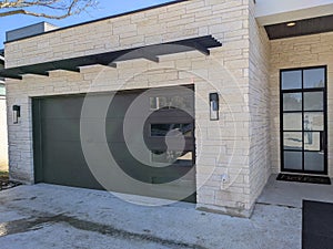 Modern house facade of garage door and main door