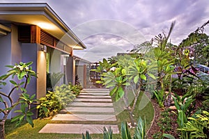 Modern house garden with colorful illumination under the sky