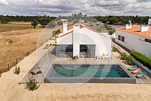 Modern house with garden swimming pool and wooden deck