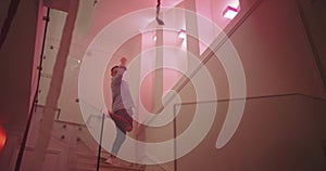 Modern house party atmosphere guy with the sunglasses dancing on the stairs he have a great and excited energy at the