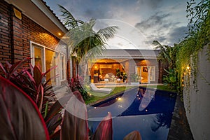 Modern house with swimming pool at night