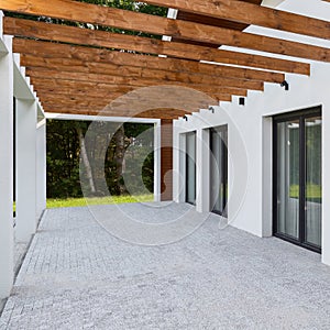 Modern house terrace with cobblestone floor