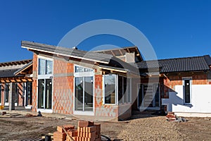 modern House under construction with polystyrene insulation and bricks