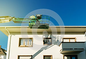 Modern hydraulic mobile construction platform with workers